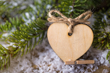 christmas heart wooden shape with fir tree