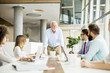 © BGStock72 - Business people discussing a strategy and working together in office