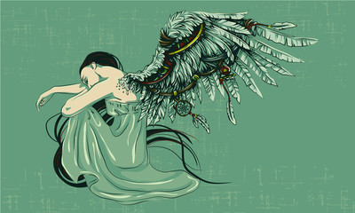 Fototapeta the sad angel folded his wings. Angel sits folding his wings