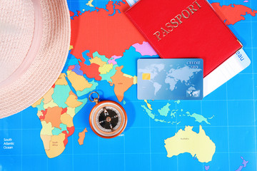 Sticker - Composition with credit card and passport on world map background