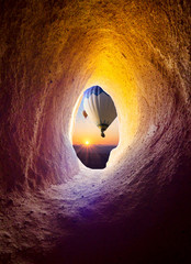 Wall Mural - Hot air balloons at sunrise for your travel concept - view from the cave window in Cappadocia.