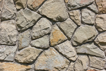 Wall Mural - Abstract background wall of large stones closeup