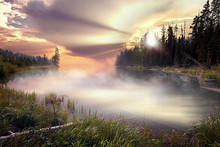 Spectacular Colorful Sunset Sunrise Landscape On A Foggy Lake With Trees In Yellowstone Hot Spring