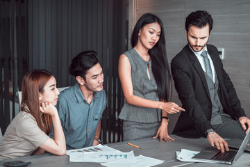 manager discussing work with his colleagues at meeting, business teamwork concept