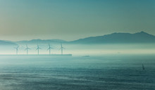 Windmill Under The Sea Mist At Dusk