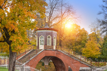 Wall Mural - beautiful autumn landscape with Krestovy Bridge and the sunset sun in the suburb of St. Petersburg Pushkin, Russia