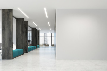 White and wooden open space office, blue sofas