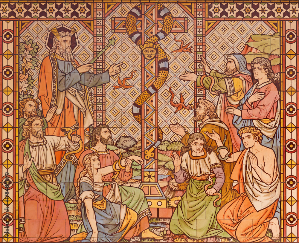 LONDON, GREAT BRITAIN - SEPTEMBER 15, 2017: The tiled mosaic of The Bronze serpent on the desert and Moses in church All Saints by Matthew Digby Wyatt (1820 - 1877).