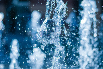 the gush of water of a fountain. splash of water in the fountain, abstract image
