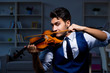 © Elnur - Young musician man practicing playing violin at home