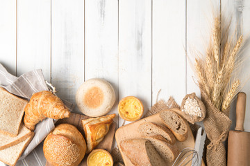 bread and bakery ingredients on white wooden