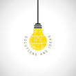 Solutions and ideas concept with hanging lightbulb made of puzzle