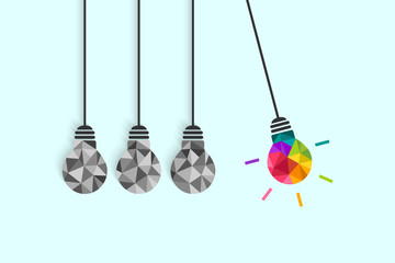 Wall Mural - newton's cradle pendulum with hanging light bulbs as idea and creativity concept. colorful bulb amon