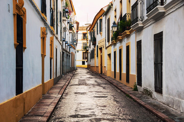 Wall Mural - Quiet empty street in residential area of Cordoba, Spain