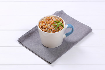 Poster - mug of cooked buckwheat