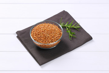 Wall Mural - bowl of raw buckwheat