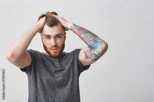 Close Up Of Young Attractive Red Haired Unhappy Man With Stylish