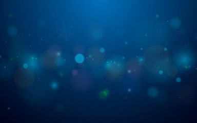 Abstract bokeh and snowflakes in blue background. Merry christmas concept
