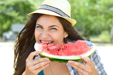 Wall Mural - Happy young woman eating watermelon on the beach. Youth lifestyle. Happiness, joy, holiday, beach, summer happiness concept.