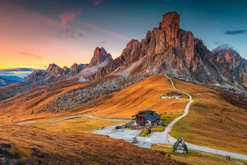 Wall Mural - Majestic alpine pass with high peaks in background, Dolomites, Italy