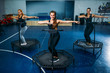 © Nomad_Soul - Women group on sport trampoline, fitness training