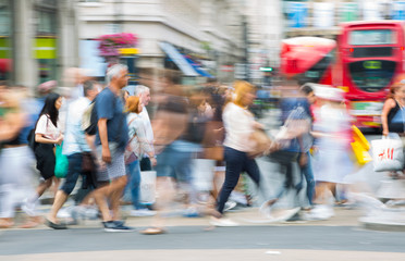 Poster - Piccadilly circus with lots of people, tourists and Londoners crossing the junction. Red bus at the background. Blurred type image. London, UK