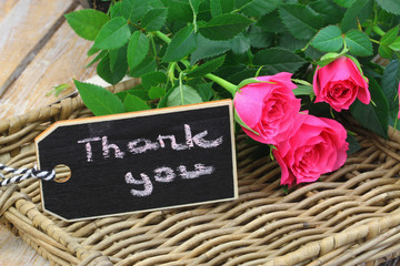 Wall Mural - Thank you written on mini blackboard with one pink rose on wicker tray
