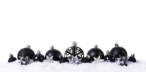black christmas balls with snow isolated on white background
