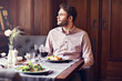© Kalim - Handsome man waiting at table in restaurant