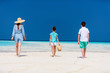 © TravelPhotoBloggers - Mother and kids at tropical beach