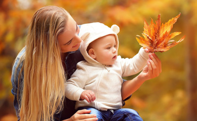 Wall Mural - Mother with son in autumn park