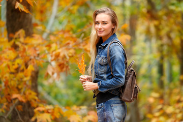 Wall Mural - Pretty girl in autumn forest