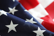 © alexkich - American flag on a wooden texture table