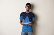 © wong yu liang - indian teenage male on tablet computer