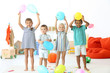 Cute children playing with balloons indoor