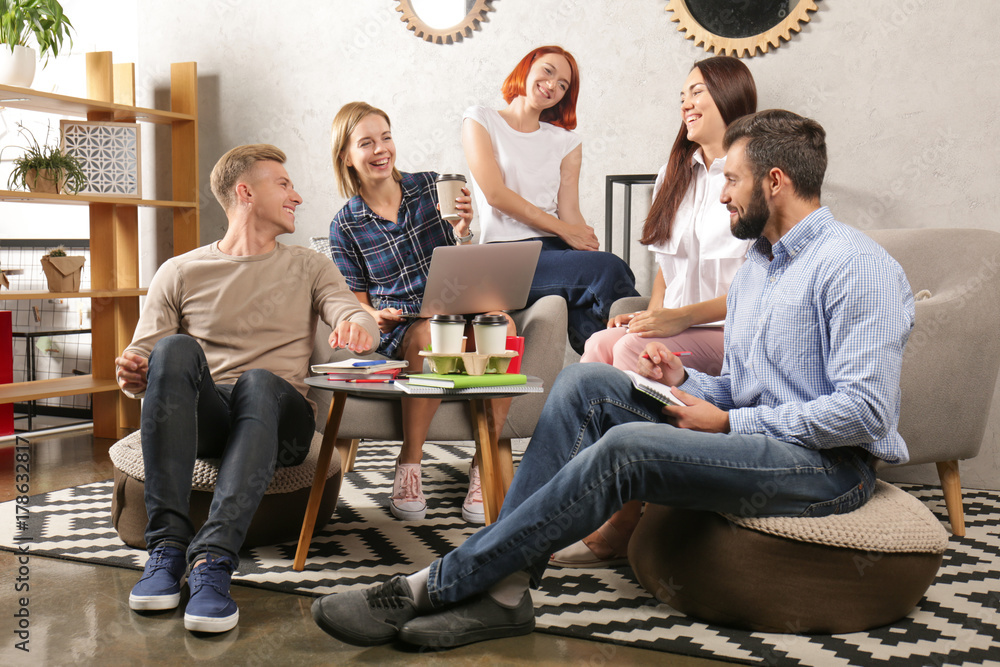 Group of young students studying indoors