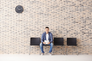 Poster - Young man waiting for job interview in hall