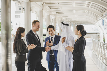 Business people shaking hands, finishing up meeting deals. Business concept.