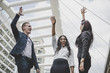 © Johnstocker - Group of Happy young business people with hands in the air success on their Plans.