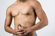 © Johnstocker - Young handsome fit man posing his muscles isolated on white background with copyspace.