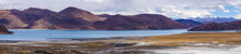 Panoramic View Of Holy Lake Yamdrok With Snowy Mountains In The Background- Tibet
