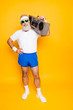 © deagreez - Crazy aged funny active sexy athlete pensioner grandpa in eyewear with bass clipping ghetto blaster recorder. Old school, swag, fooling around, gym, workout, technology, groove