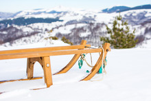 Wooden Sleds On Snow Covered Mountain