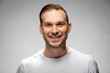 © Photocreo Bednarek - Handsome smiling man. Studio portrait.