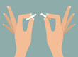 Woman's hands tearing apart cigarette. Quitting smoking concept