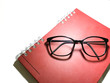 Red Book and Glasses on a white background. represent the drawing concept related idea. - I like the feel of this, might be something l try to create for my body background