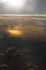 Wall Mural - Sunset White Cloud sky at high level attitude, view from window airplane