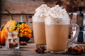 Wall Mural - Pumpkin spice latte with whipped cream and cinnamon