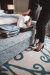 © LIGHTFIELD STUDIOS - businesswoman unpacking suitcase in hotel room