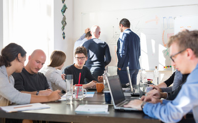 Wall Mural - relaxed informal it business startup company meeting. teams discussing and brainstorming new approac